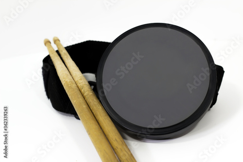 drummer practice pad with drum sticks / isolated background