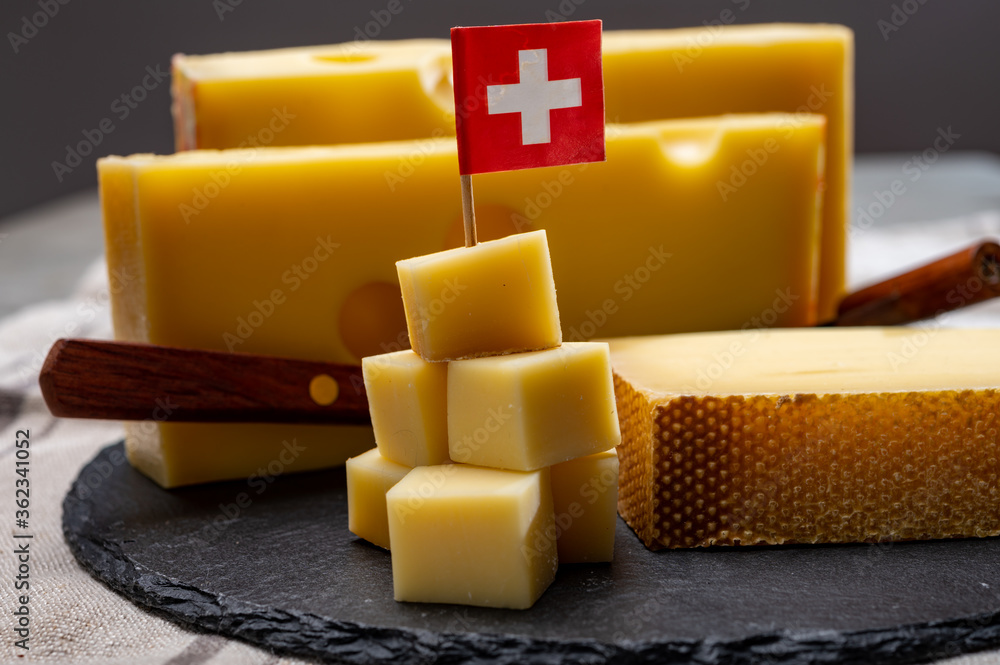Swiss cheeses, block of medium-hard yellow cheese emmental or