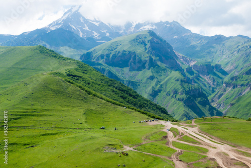 Caucasus Mountains view from Gergeti Trinity Church on Kazbegi National Park in Kazbegi, Mtskheta-Mtianeti, Georgia.