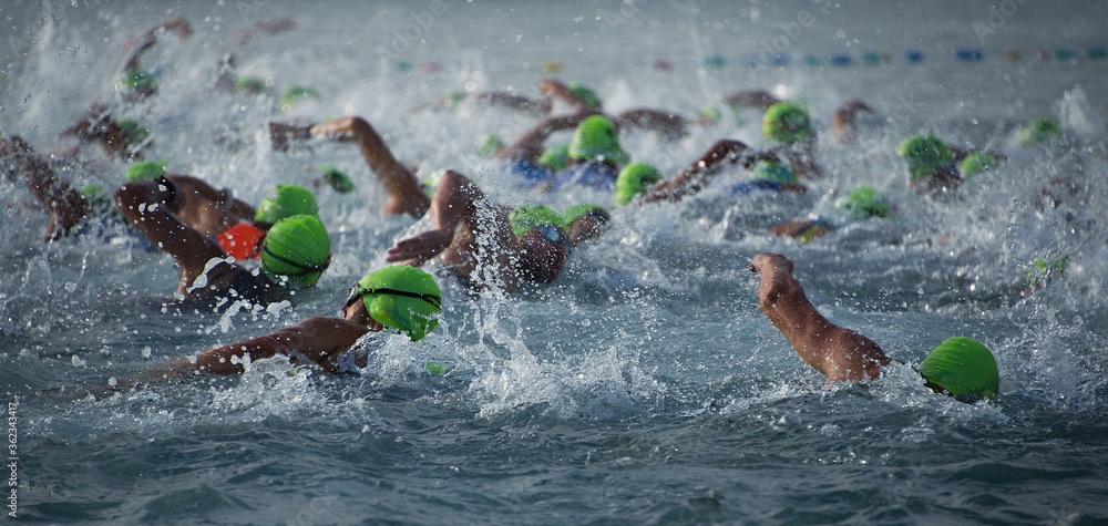 Ταπετσαρία Competitors swimming out into open water at the beginning of triathlon