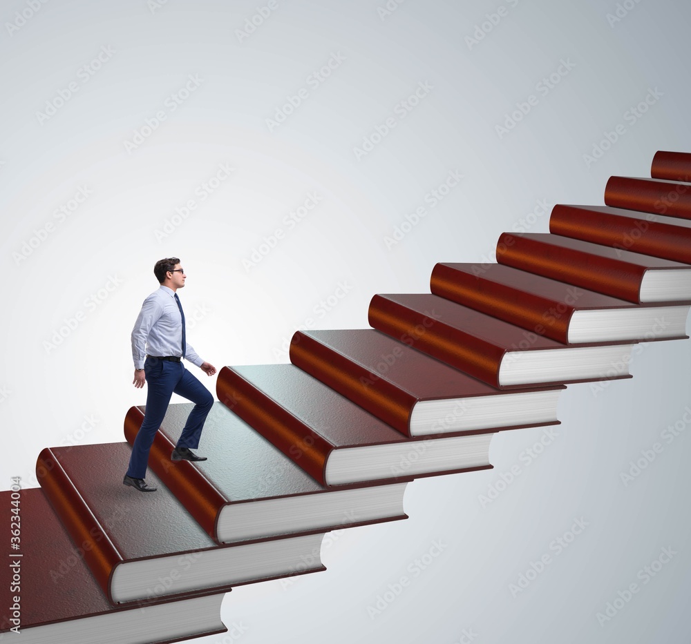 Businessman student climbing the ladder of education books Businessman student climbing the ladder of education books