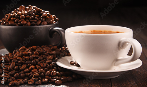 Composition with two cups of coffee and beans