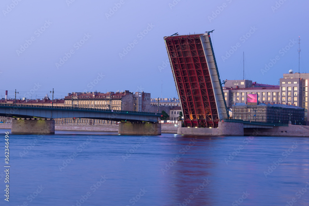 View of the divorced Liteiny Bridge on a white night. Saint-Petersburg, Russia