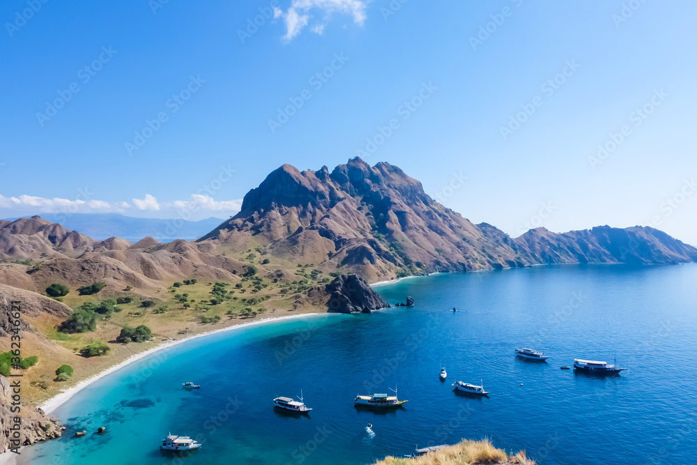 Fototapeta Boats parking near Padar island in the Komodo National Park, Indonesia. As seen from the top of the mountain.