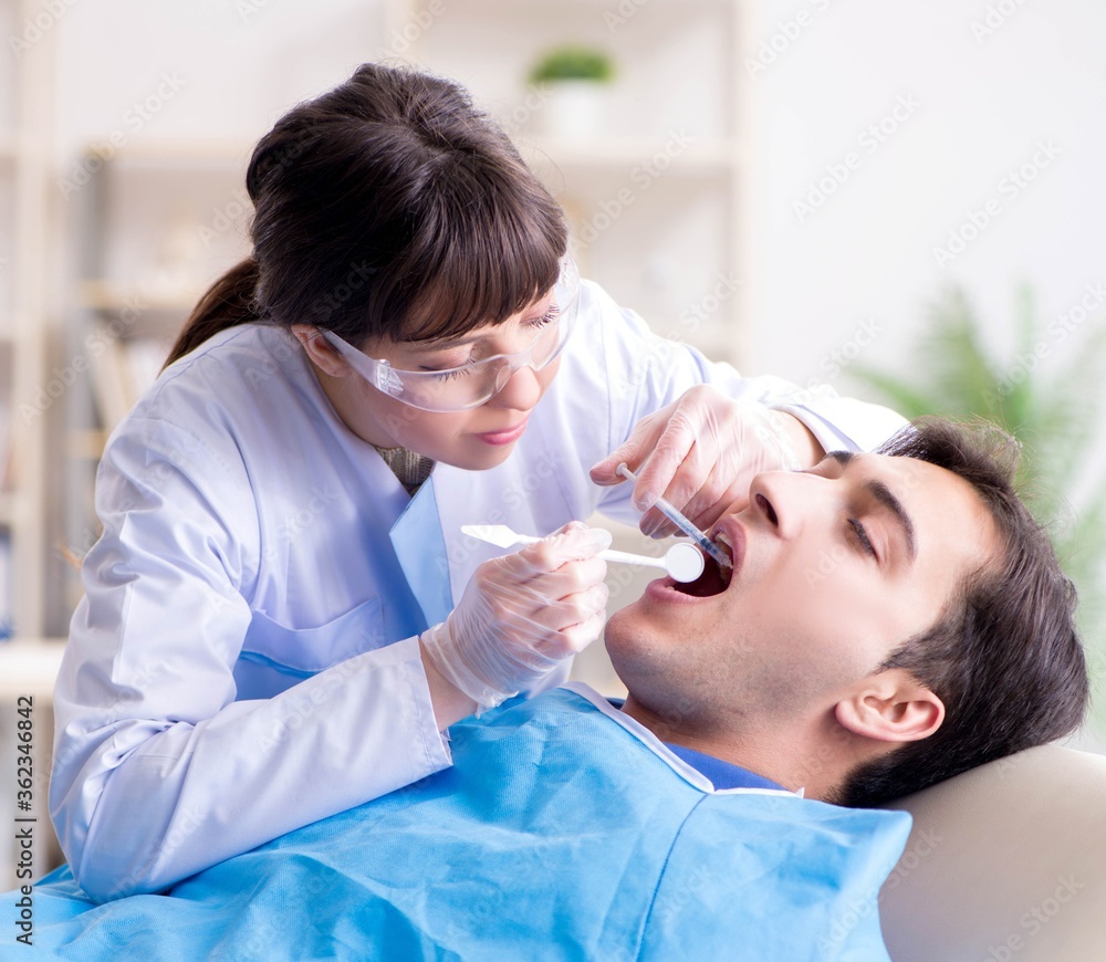 Patient visiting dentist for regular check-up and filling Patient visiting dentist for regular check-up and filling