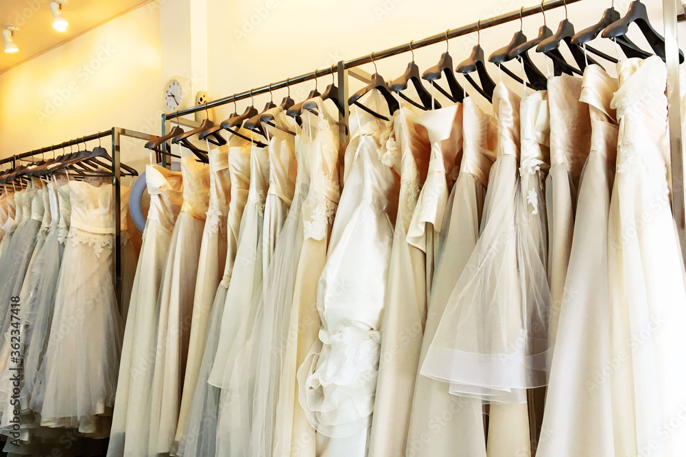 many Evening dress Of the bride In wedding studio shop