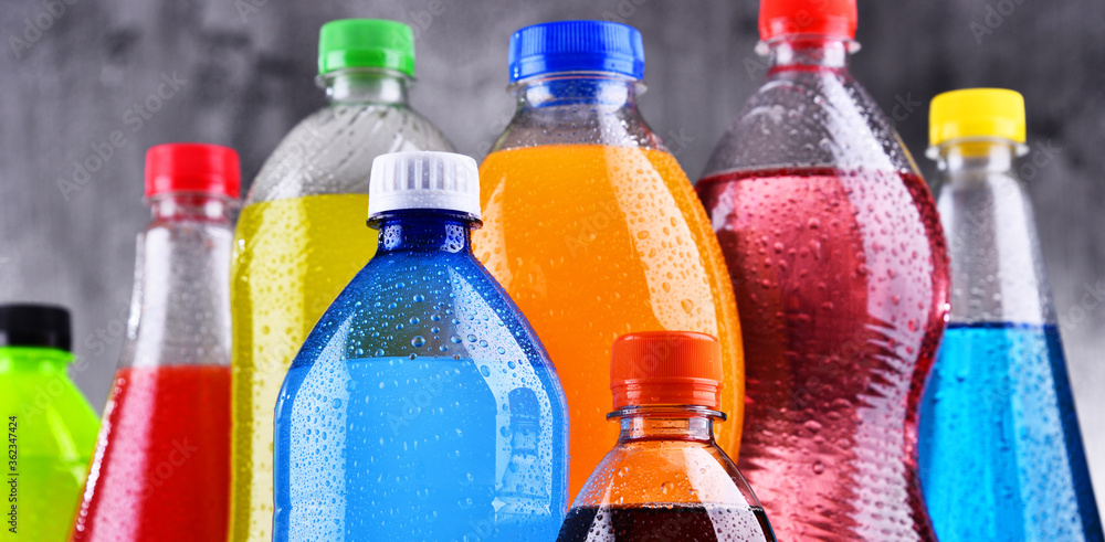 Plastic bottles of assorted carbonated soft drinks - obrazy, fototapety, plakaty 