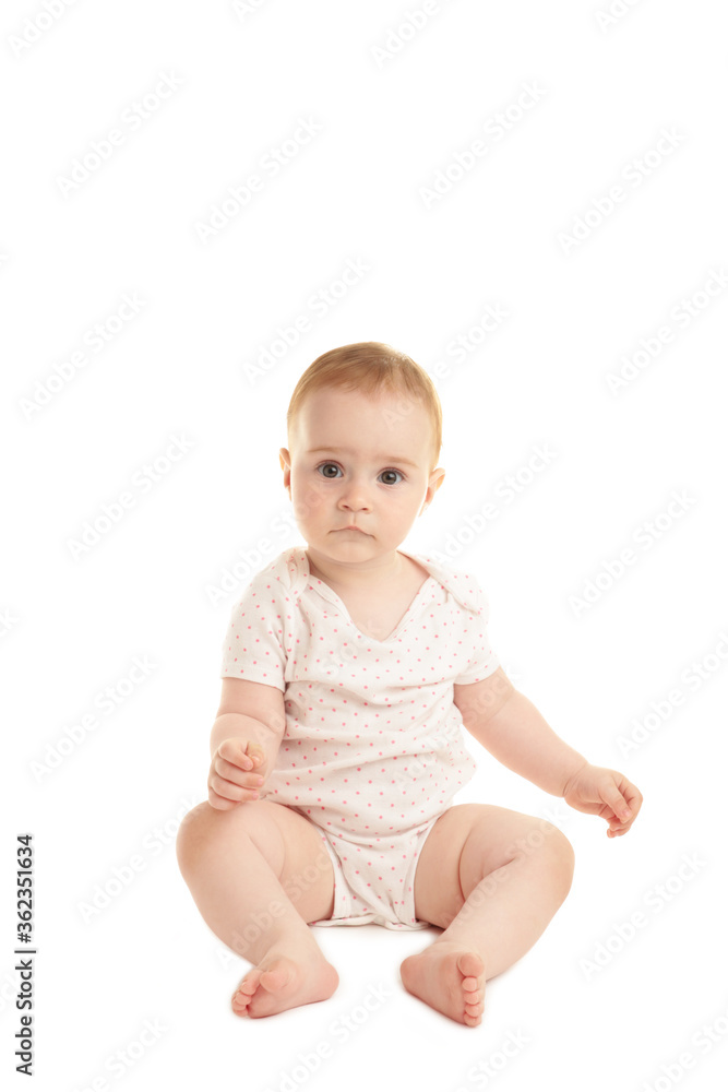 Sweet little girl sitting isolated on white background Sweet little girl sitting isolated on white background