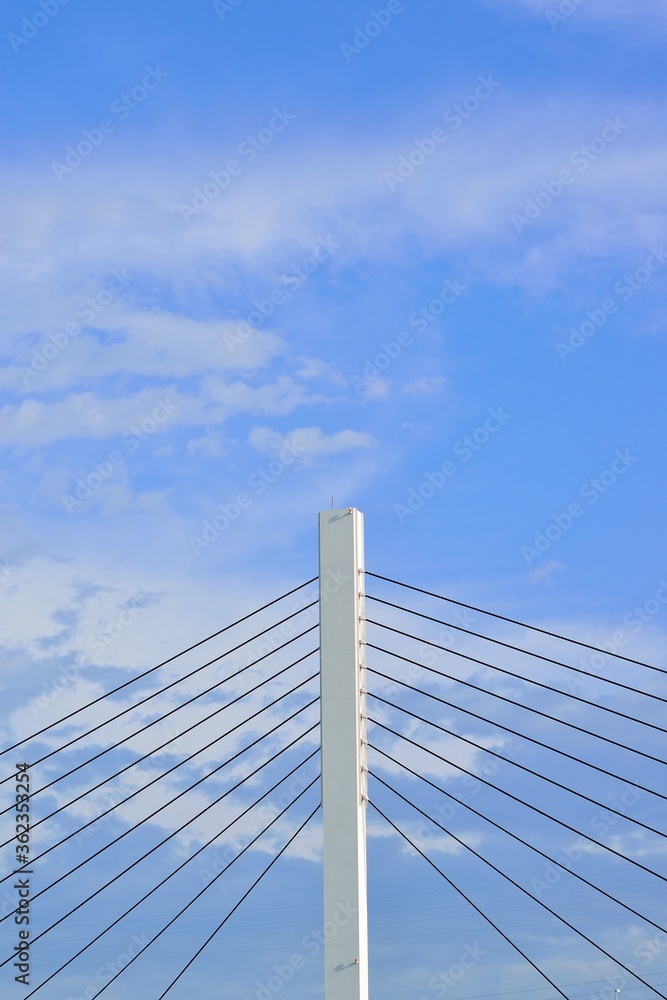 Architecture details of strong suspension bridge in blue sky background