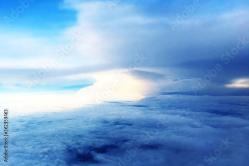 beautiful landscape view background of sky above cloud when look from plane's window