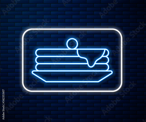 Glowing neon line Stack of pancakes icon isolated on brick wall background. Baking with syrup and cherry. Breakfast concept. Vector Illustration.