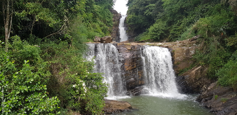 Fototapeta premium Kadiyanlena waterfall in the mountains, Srilanka .