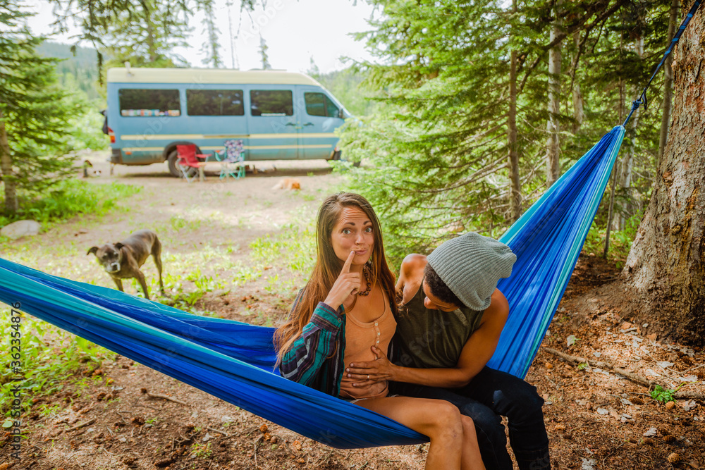 Lesbian couple in hammock out camping Stock Photo | Adobe Stock