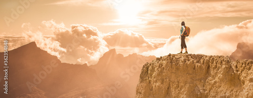 silhouette of successful climbing woman in mountains Concept of concept of motion motivation inspiration at beautiful sunset