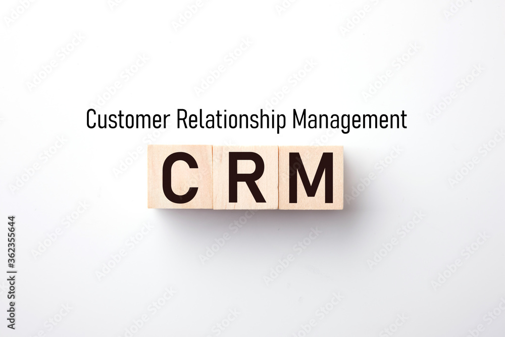 Customer Relationship Management : Business text on wood block on White background. Customer Relationship Management : Business text on wood block on White background.