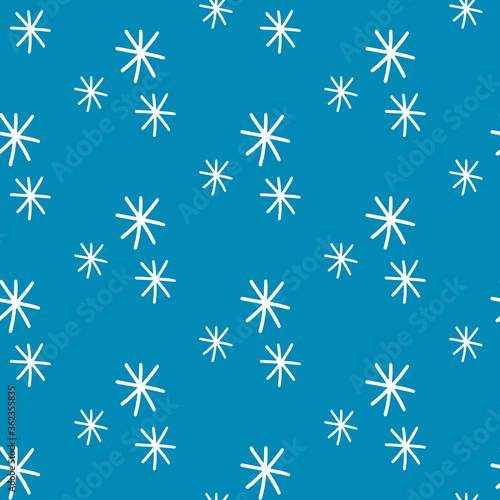 White snowflakes on blue background. Seamless pattern in scandinavian modern style. Ornament for fabric, wallpaper, packaging, cards, wrapping paper. Vector stock illustration.