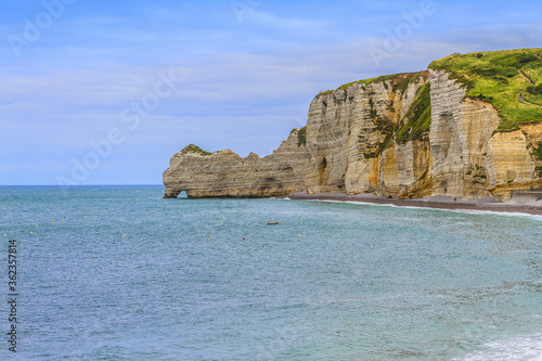 Famous cliffs "d’Amont" of Etretat. Etretat is now a famous French seaside resort. Etretat is a commune in the Seine-Maritime department in the Haute-Normandie region in northwestern France.