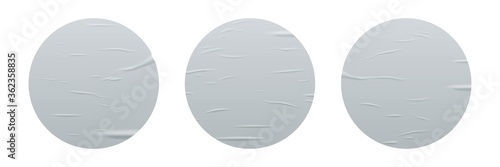 Glued round stickers set isolated on white background. Vector realistic crumpled posters bundle. Wet greased wrinkles blank template texture. Empty advertising circles mockup for creative design.