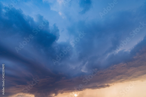 Dark storm clouds before the rain at sunset.