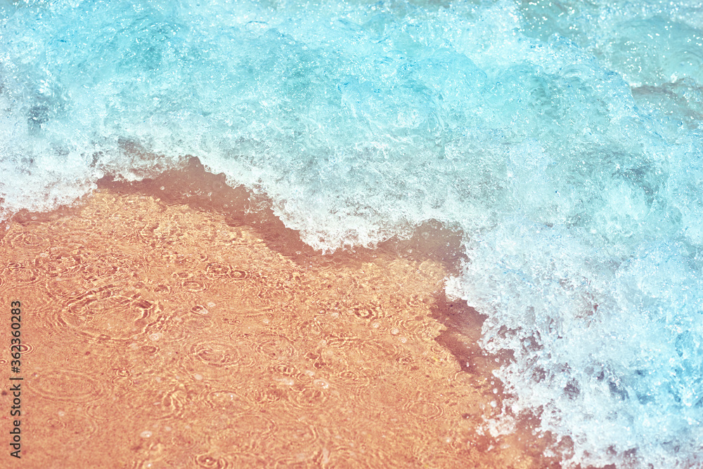 Sea wave on the sand beach, soft focus. Summer background Sea wave on the sand beach, soft focus. Summer background