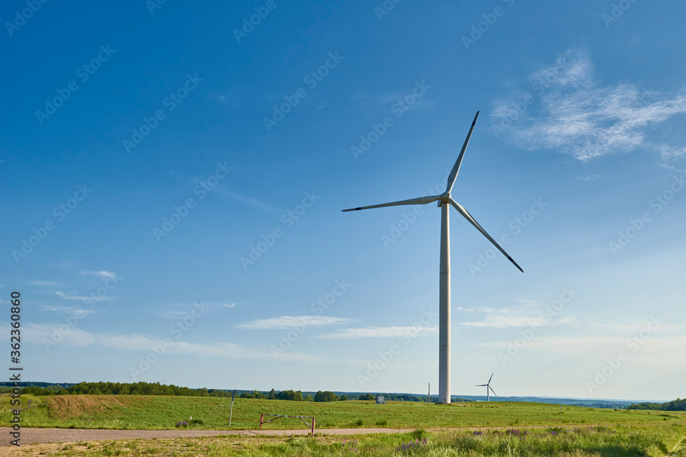 Wind turbine in the field. Wind power energy concept Wind turbine in the field. Wind power energy concept