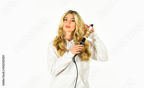 Hairdresser tips. Heat setting for hair type. Girl adorable blonde hold curling iron. Gorgeous hairstyle. Create beautiful hairstyle with curling iron. Woman with long curly hair use curling iron