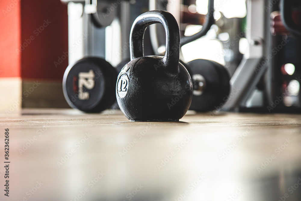 Kettlebells on the background of the interior of the gym without people Kettlebells on the background of the interior of the gym without people
