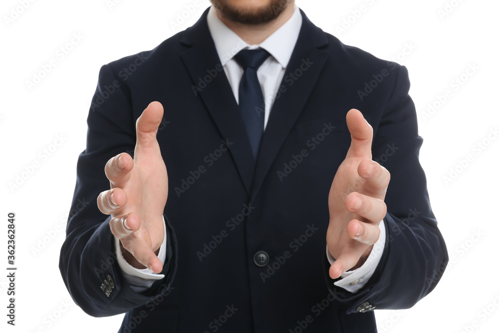 Businessman holding something against white background, focus on hands Businessman holding something against white background, focus on hands