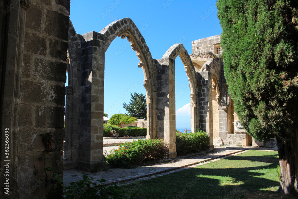 Bellapais Abbey, White Abbey, Abbey of the Beautiful world. Arches against the blue sky.