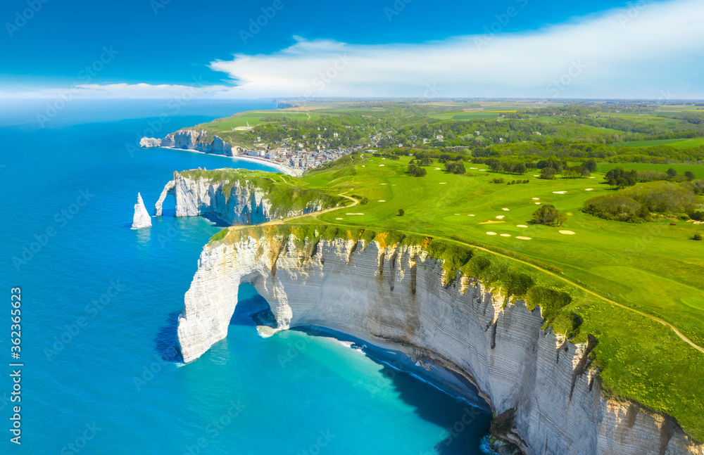 Picturesque panoramic landscape on the cliffs of Etretat. Natural amazing cliffs. Etretat, Normandy, France, La Manche or English Channel. Coast of the Pays de Caux area in sunny summer day. France