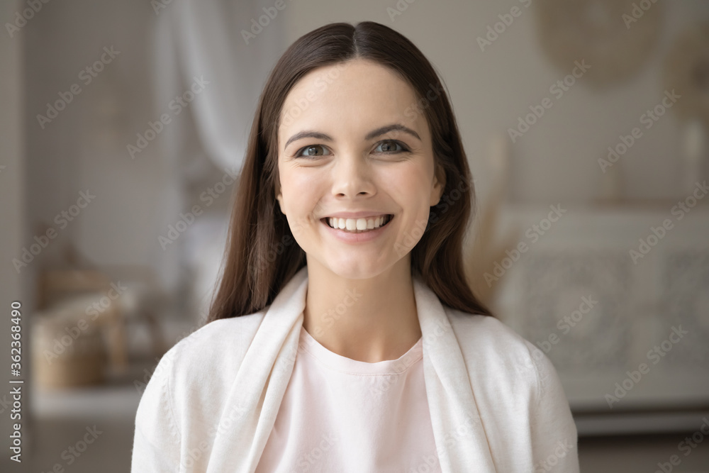 Head shot portrait beautiful young woman with healthy toothy smile and perfect smooth skin looking at camera, attractive overjoyed girl making video call, shooting vlog for social network Head shot portrait beautiful young woman with healthy toothy smile and perfect smooth skin looking at camera, attractive overjoyed girl making video call, shooting vlog for social network