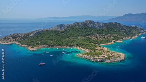 Aerial drone photo of secluded paradise bay and small island of Moni with turquoise crystal clear beach next to Aigina, Saronic gulf, Greece