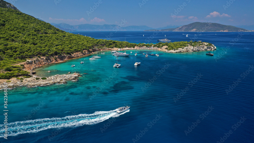 Aerial drone photo of secluded paradise bay and small island of Moni with turquoise crystal clear beach next to Aigina, Saronic gulf, Greece