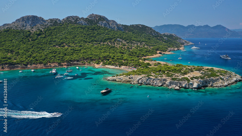 Aerial drone photo of secluded paradise bay and small island of Moni with turquoise crystal clear beach next to Aigina, Saronic gulf, Greece