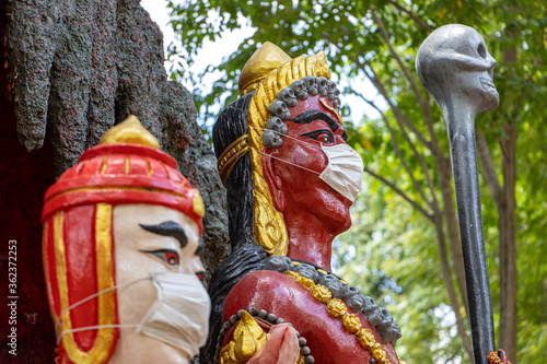 Obraz na plátně The portrait of the Demon King with face mask, Wat​ Muang​ temple​ located​ Ang​ Thong and Ayutthaya​ during coronavirus pandemic, Thailand