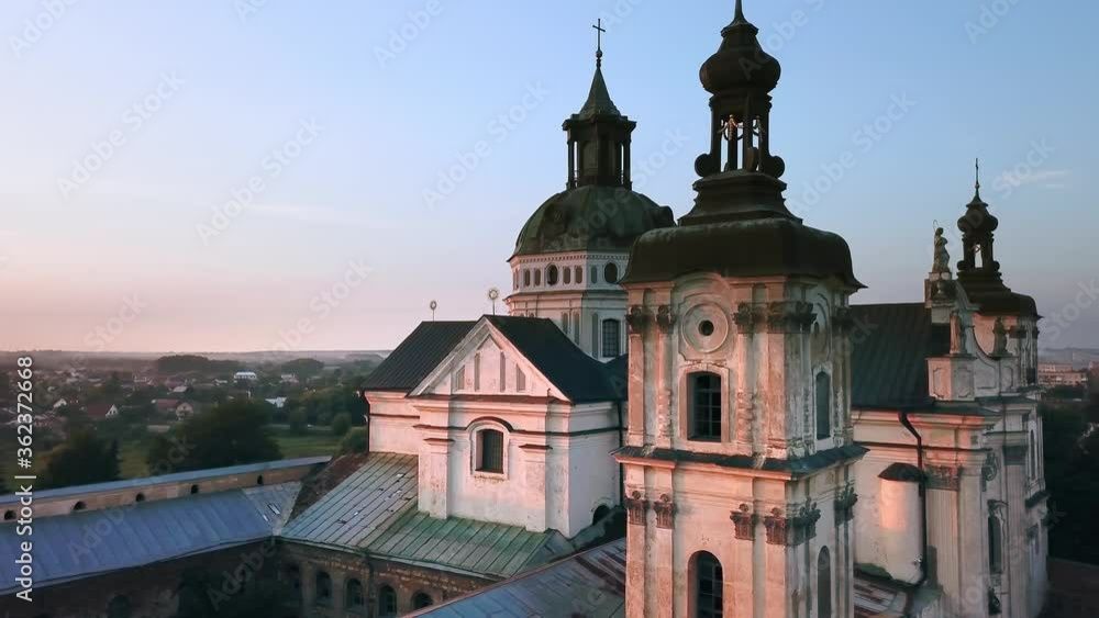 Aerial view of Monastery of the Barefoot Carmelites at sunset, Medieval Catholic ancient fortress in Berdichiv city, Ukraine. Monastery of the Barefoot Carmelites, Aerial survey of Monastery of the Ba Aerial view of Monastery of the Barefoot Carmelites at sunset, Medieval Catholic ancient fortress in Berdichiv city, Ukraine. Monastery of the Barefoot Carmelites, Aerial survey of Monastery of the Ba