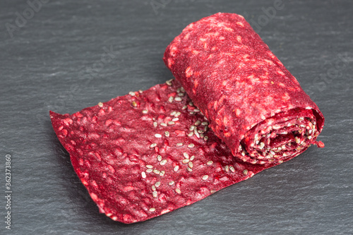 rolls of raspberry fruit leather with chia seeds photo