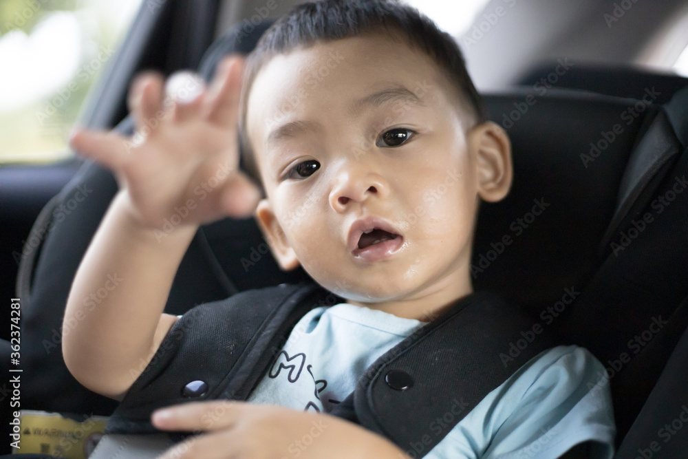 1 Year Old Adorable Asian Boy Alone Looking Around From Car Seat in the Car 1 Year Old Adorable Asian Boy Alone Looking Around From Car Seat in the Car
