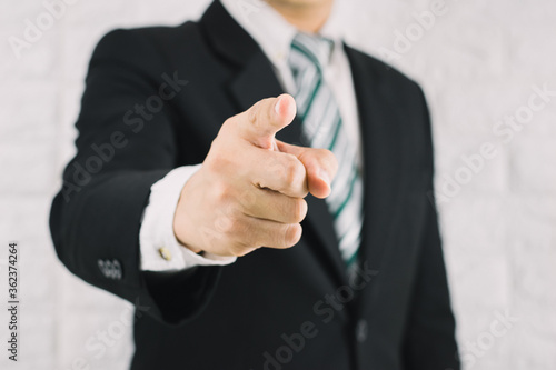 Business man pointing finger of command concept