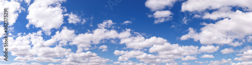 Fototapeta Naklejka Na Ścianę i Meble -  Clouds in blue sky. White, fluffy clouds In blue sky. Background nature. Texture cumulus floating on blue sky. Backgrounds concept. Environment, atmosphere. Place for an inscription or logo