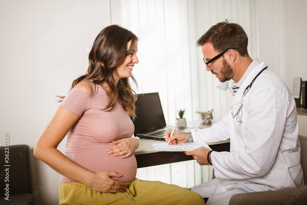 Gynecologist doctor and pregnant woman meeting at hospital Gynecologist doctor and pregnant woman meeting at hospital
