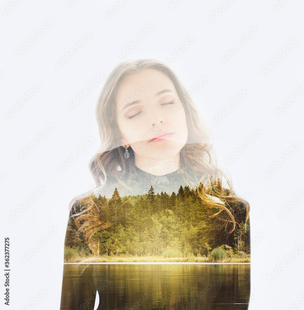 Double exposure portrait of a young dreamy woman combined with photograph of nature landscape. Conceptual image showing unity of human with nature. Ecology, freedom, environment. Isolated on white Double exposure portrait of a young dreamy woman combined with photograph of nature landscape. Conceptual image showing unity of human with nature. Ecology, freedom, environment. Isolated on white