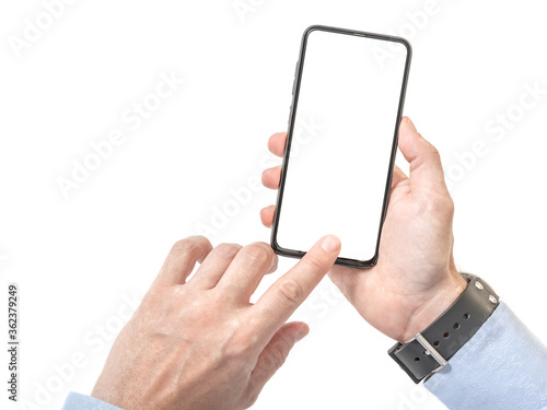 man hand holding the black smartphone with blank screen and modern frameless design. isolated on white background