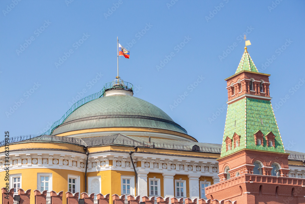 View of The Senate Tower of Moscow Kremlin and Residence of the President of Russia from Red Square in Moscow, Russia. Clear blue sky. Landmark theme.