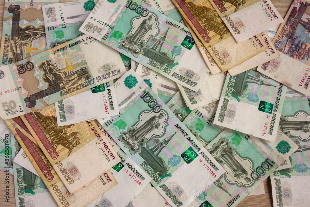 Money, Russian banknotes of various denominations are scattered on the table. Money, Russian banknotes of various denominations are scattered on the table.