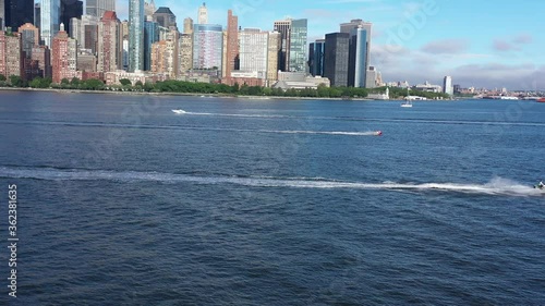 4K RAW Footage in D-log: Jet Ski riding along the Manhattan waterfront at sunny. New York, USA