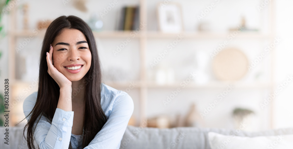 Portrait Of Beautiful Asian Girl Resting At Home, Smiling At Camera Portrait Of Beautiful Asian Girl Resting At Home, Smiling At Camera