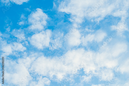 White clouds are soft and fluffy floating on blue sky for backgrounds concept.