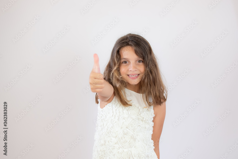 Beautiful little girl making finger up gesture Beautiful little girl making finger up gesture