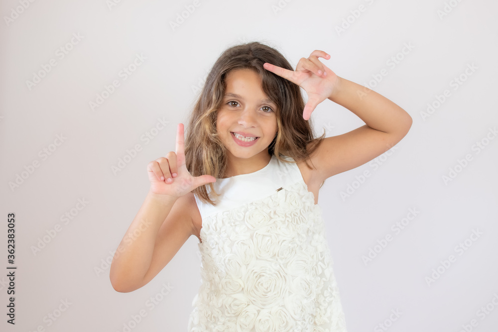 Beautiful little girl making portrait gesture Beautiful little girl making portrait gesture